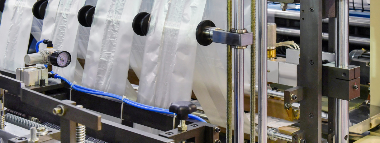 Plastic packaging machine in operation.